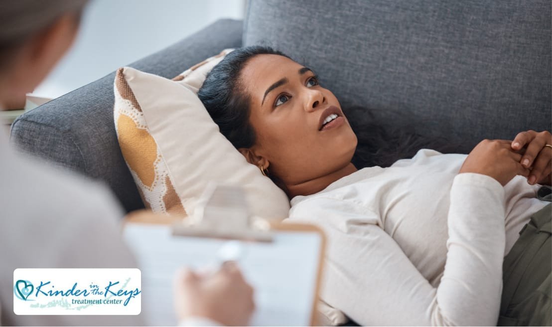 Woman lying on a couch during a therapy session for holistic depression treatment at Kinder in the Keys